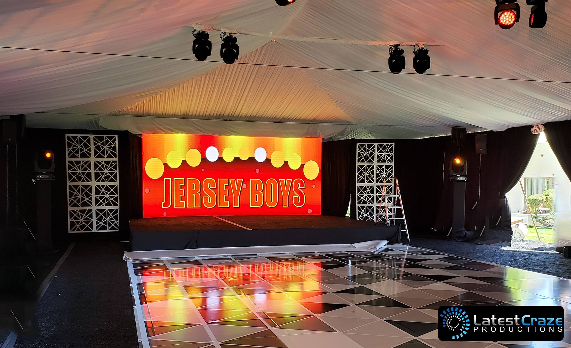 led video wall stage backdrop in tent Latest Craze Productions